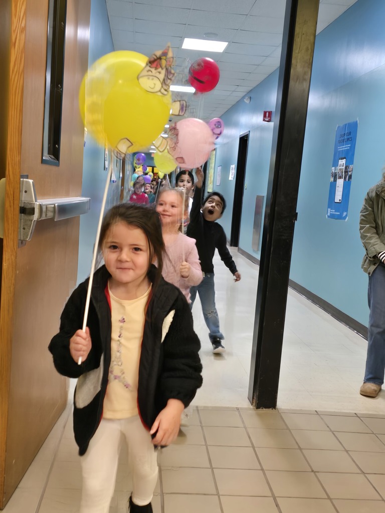 Image of students walking in their balloon parade