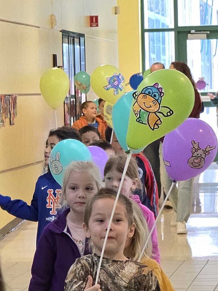 Image of students walking in their balloon parade