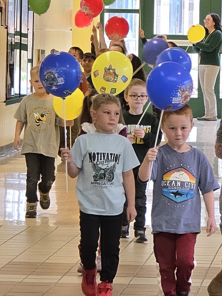 Image of students walking in their balloon parade