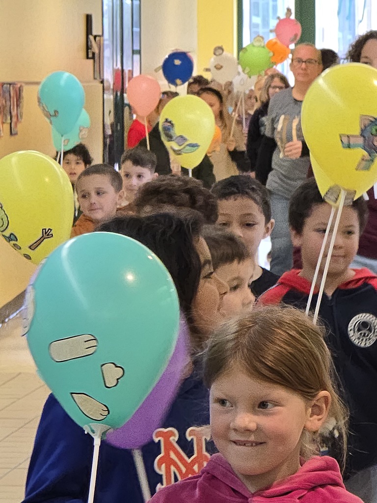 Image of students walking in their balloon parade