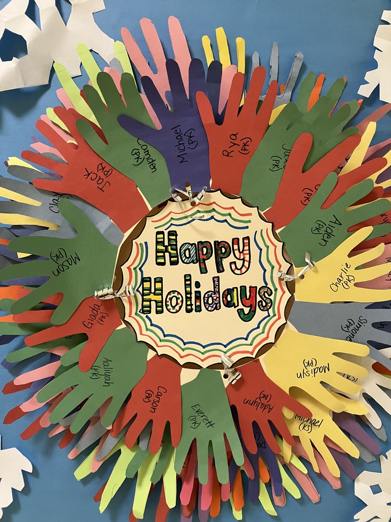 A holiday wreath made from traced handprints