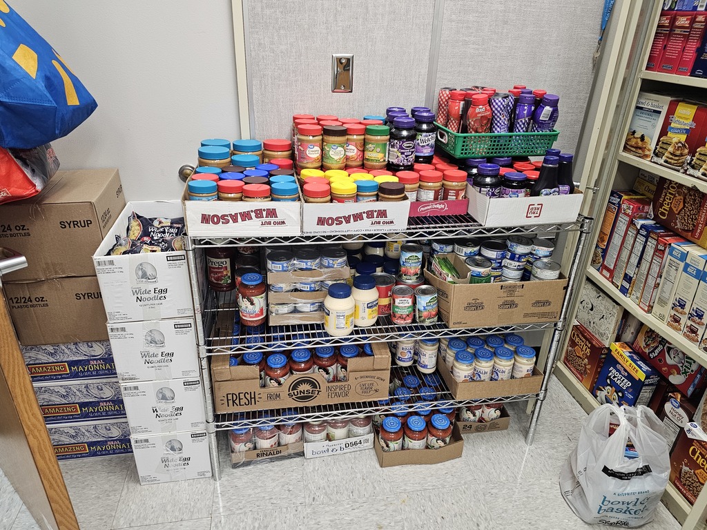Image of a food pantry with shelves stocked with food