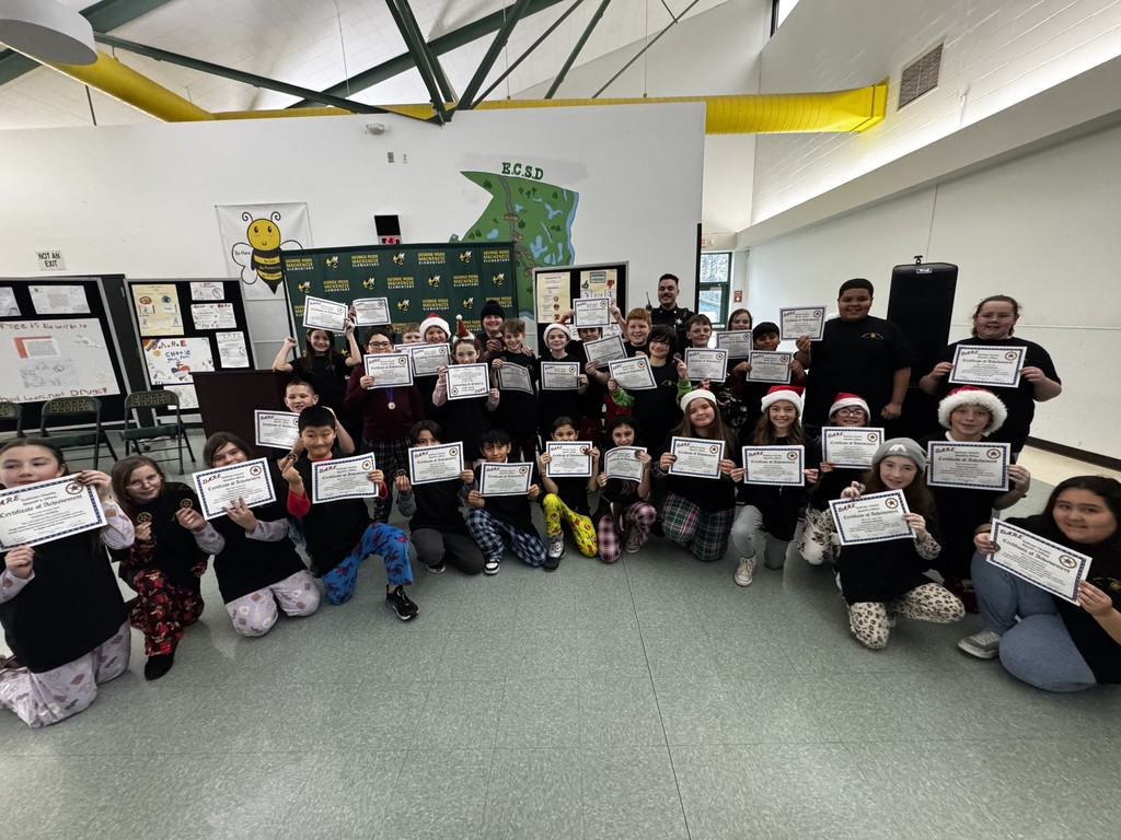 Image of our 2025 5th Grade DARE graduates holding their certificates
