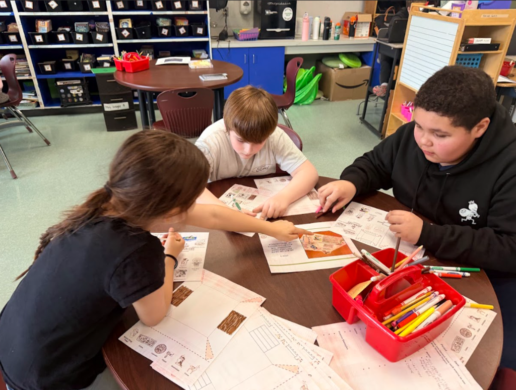 image of student constructing a 3D pyramid for their ancient civilizations  unit