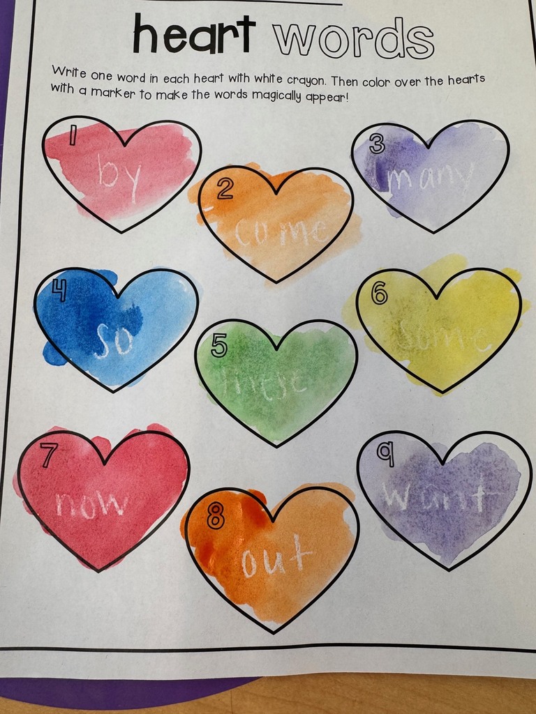 Image of a worksheet with "heart" (high frequency) words on it. The words are in hearts that student had to water color.