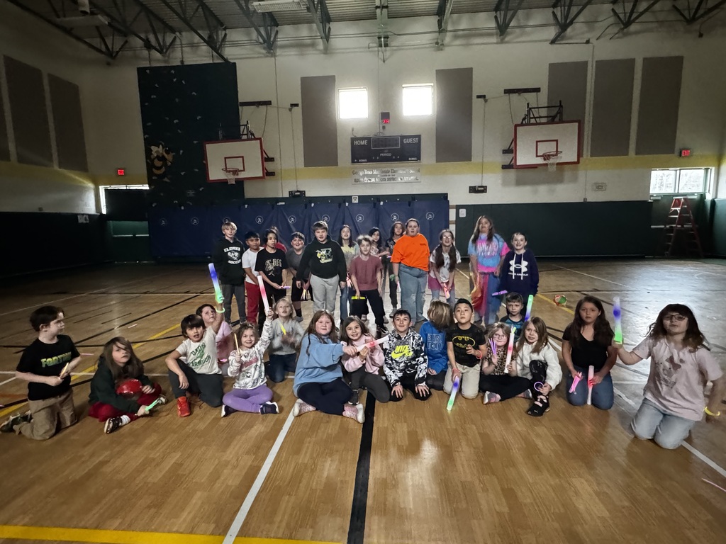Image of students posing for the camera before they celebrate at a glow party