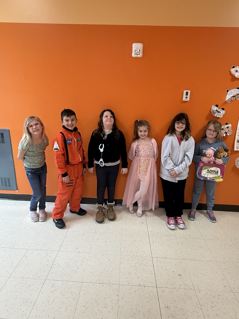 image of student dressed in costume of what they want to be when they grow up-shown is a teacher, an astronaut, a police office, a dancer and a veterinarian