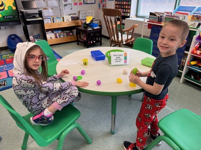 Image of  students posing with their egg stem activity