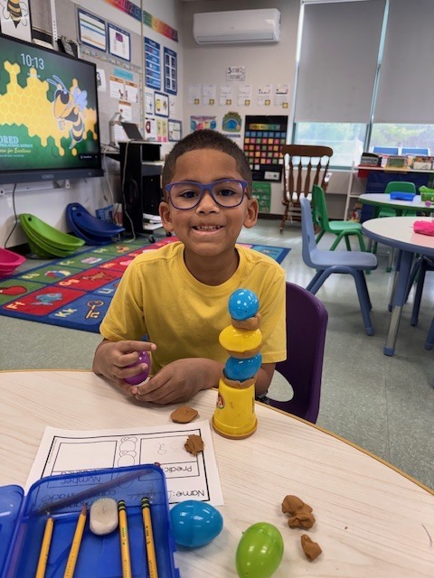 Image of a student posing with his egg stem activity