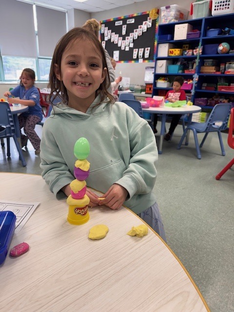 Image of a student posing with her egg stem activity