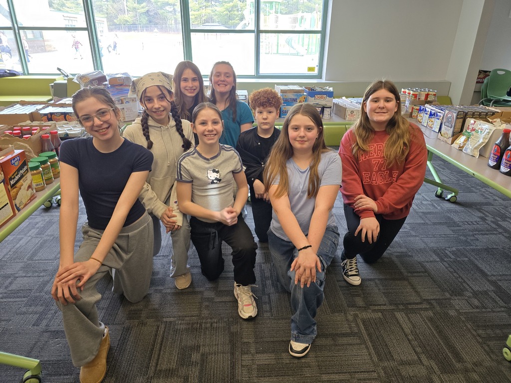 Image of a group of students who are being recognized for volunteering to set up a community food drive