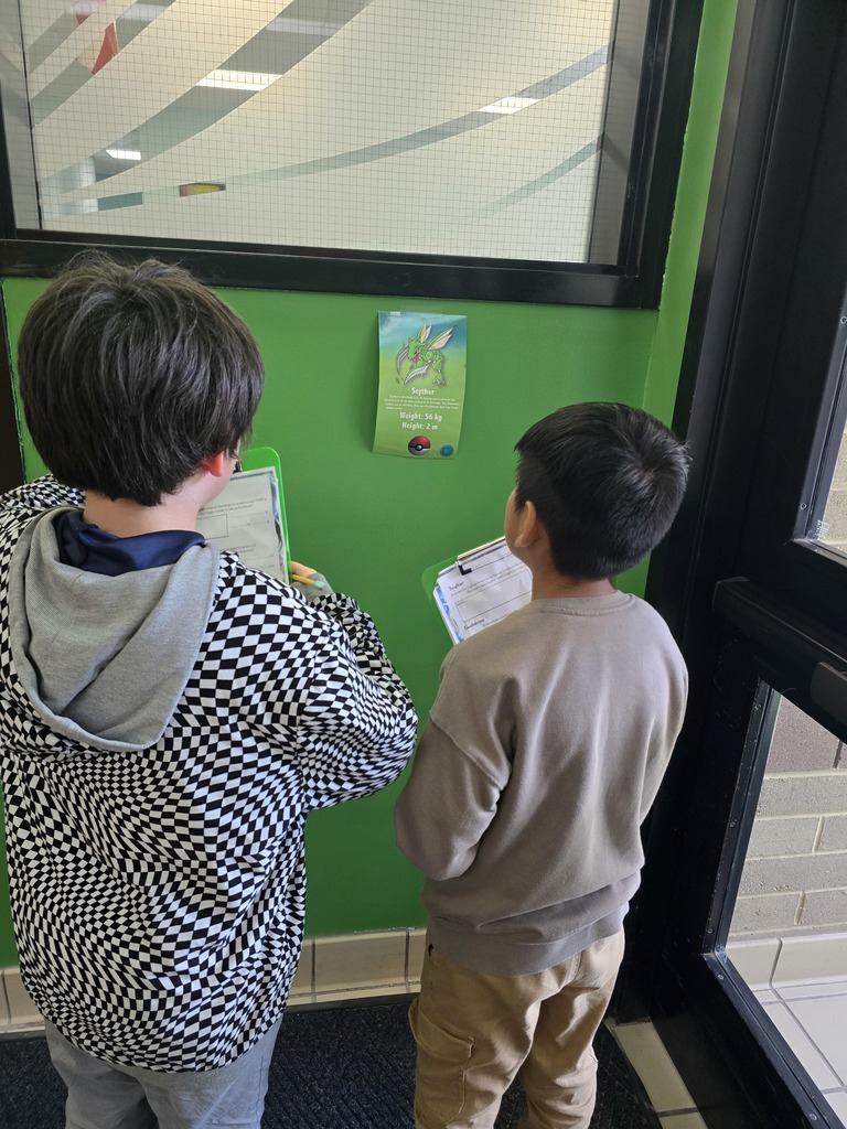 Image of students in a school hallway looking for Pokemon for a math assignment