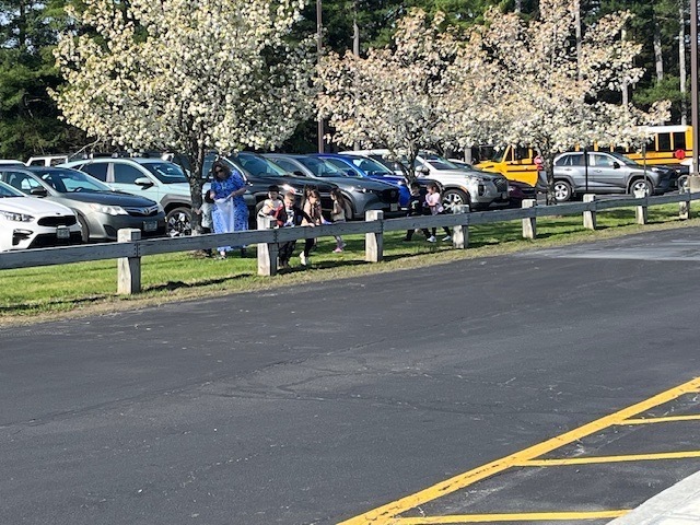 Image of student participating in a litter pluck for Earth Day on school grounds
