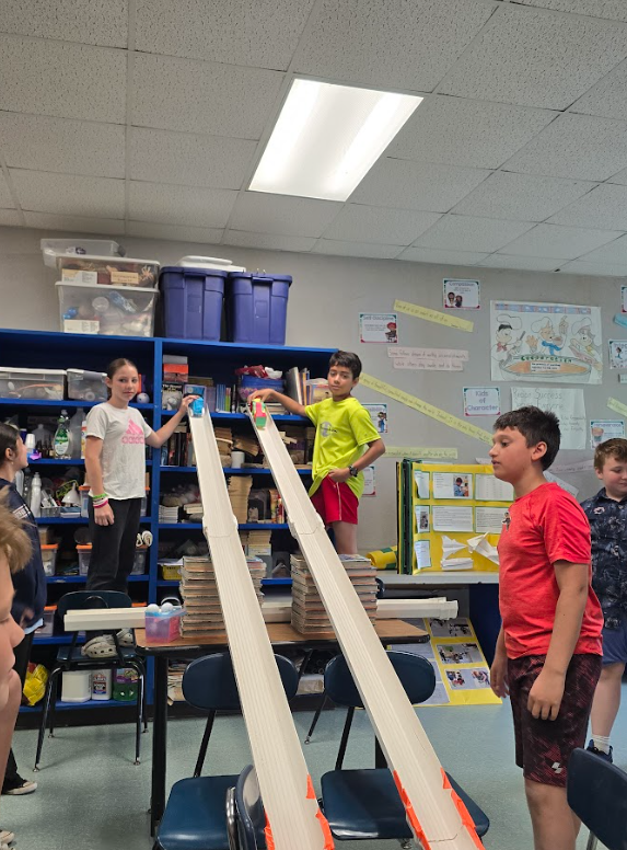 Image of student racing their egg car racers