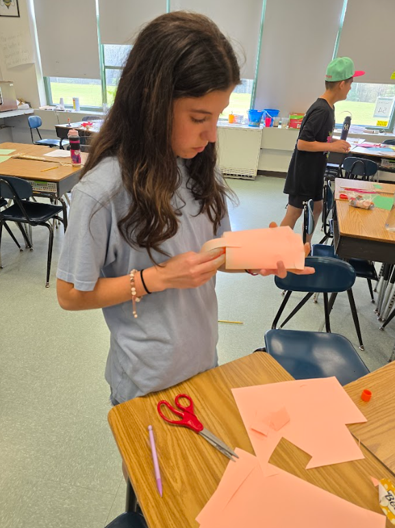 A student makes a model for her egg car racer