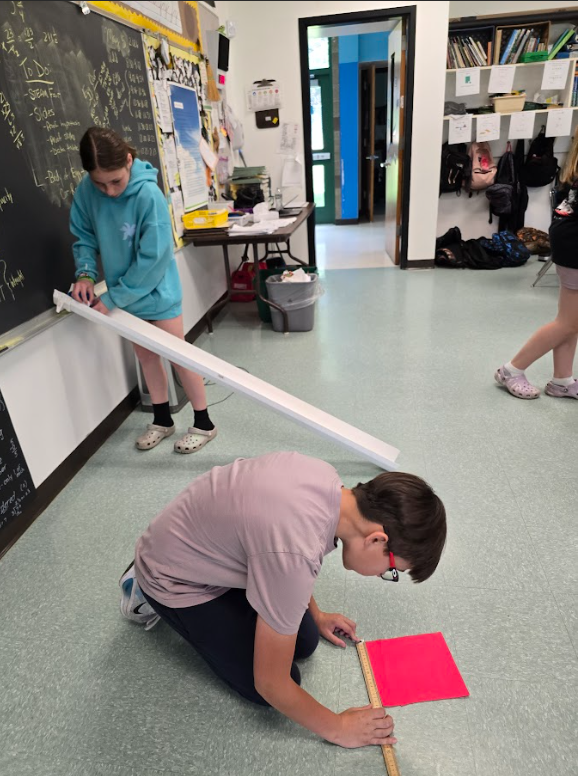 Image of students testing a ramp for their egg car racers