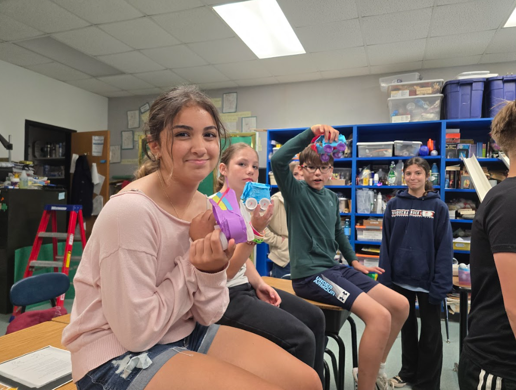 Image of students with their egg car racers