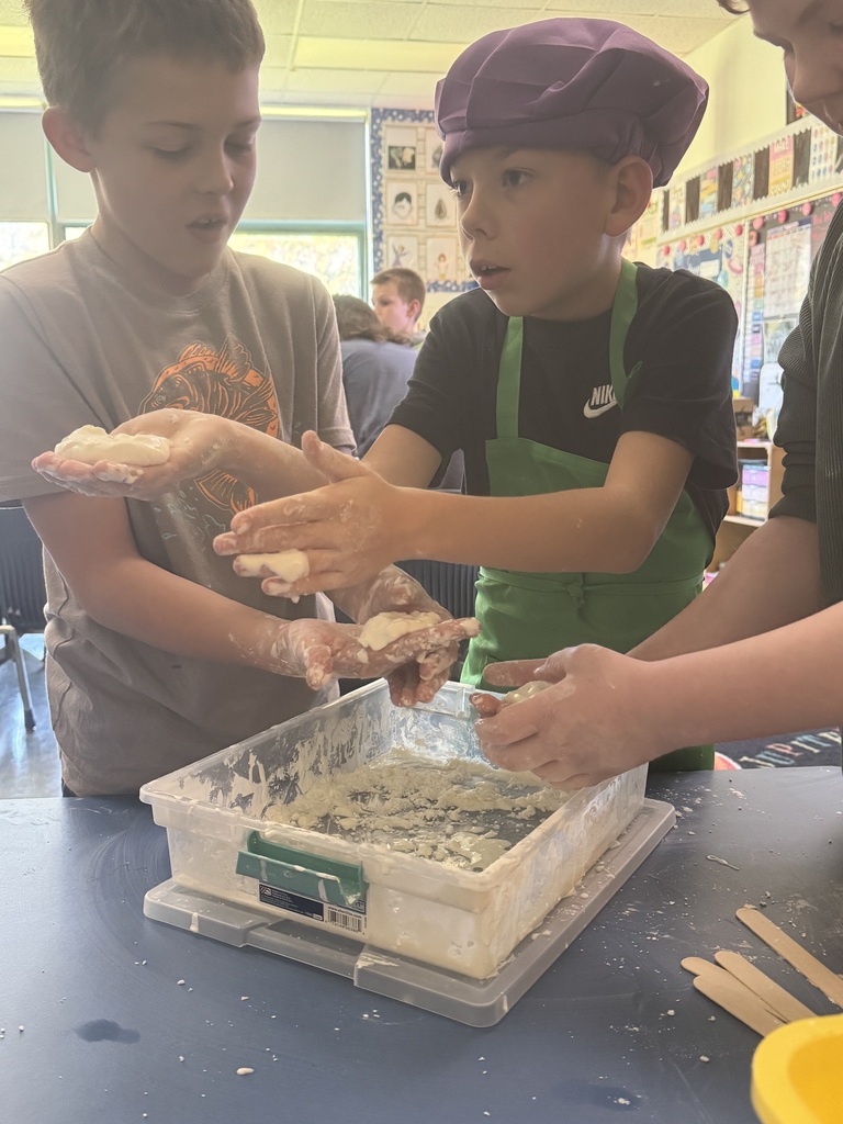 Students participate in a science lab on the Law of Conservation of Matter by making OOBLEK.