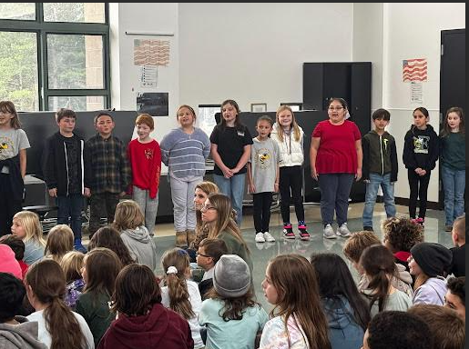 image of students performing a song during a Veterans Day event