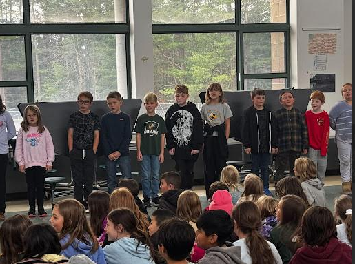 image of students performing a song during a Veterans Day event