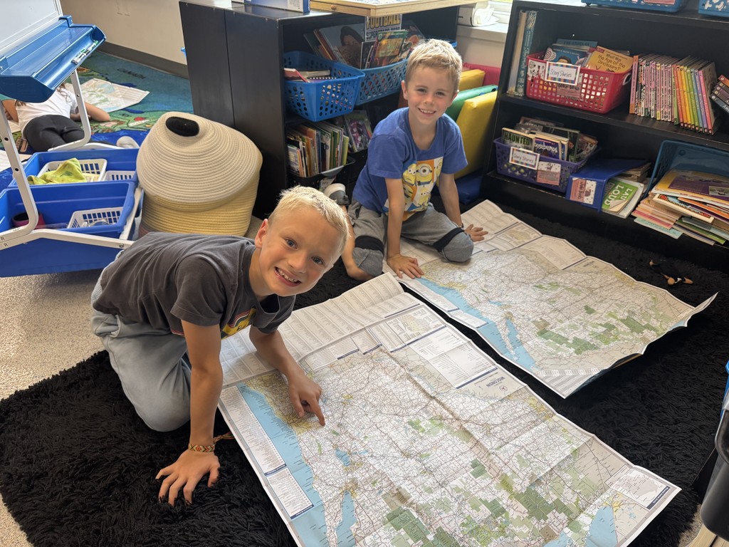 These young explorers are practicing their map skills.