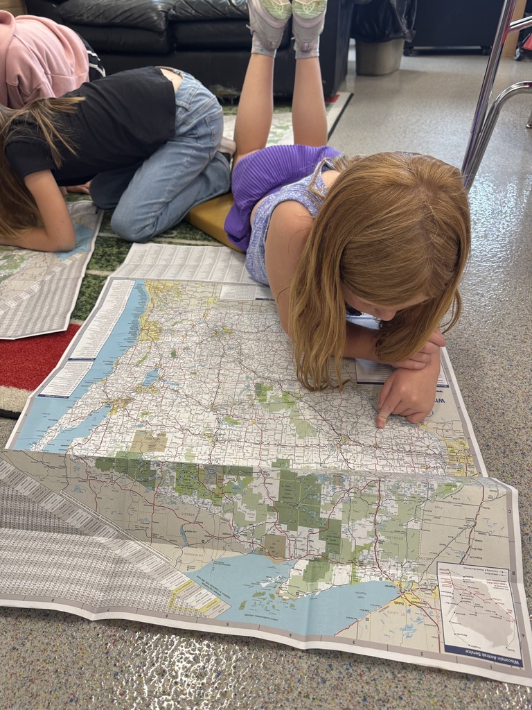 These young explorers are practicing their map skills.