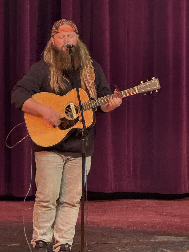 Community members attend the Harmony in the Heart of Community concert featuring singer Chris Kroeze. Student musicians Rowan and Gabe Koxlien and local performer Todd Barneson also perform, with proceeds benefiting Eleva-Strum students and community programs.