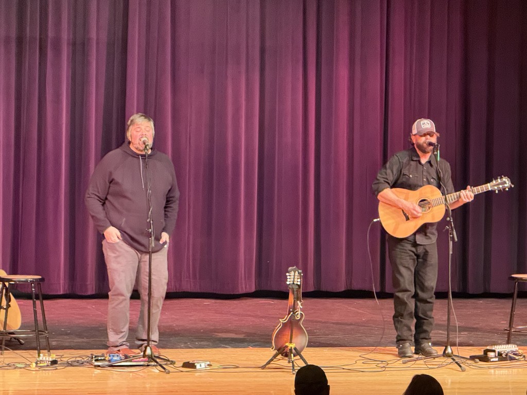 Community members attend the Harmony in the Heart of Community concert featuring singer Chris Kroeze. Student musicians Rowan and Gabe Koxlien and local performer Todd Barneson also perform, with proceeds benefiting Eleva-Strum students and community programs.