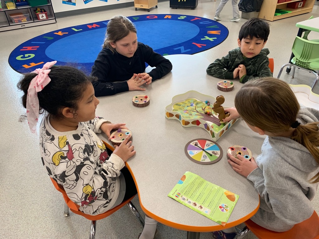 Students in grades 3–5 volunteered to play games with 4K friends, building social skills like turn-taking, teamwork, and following directions