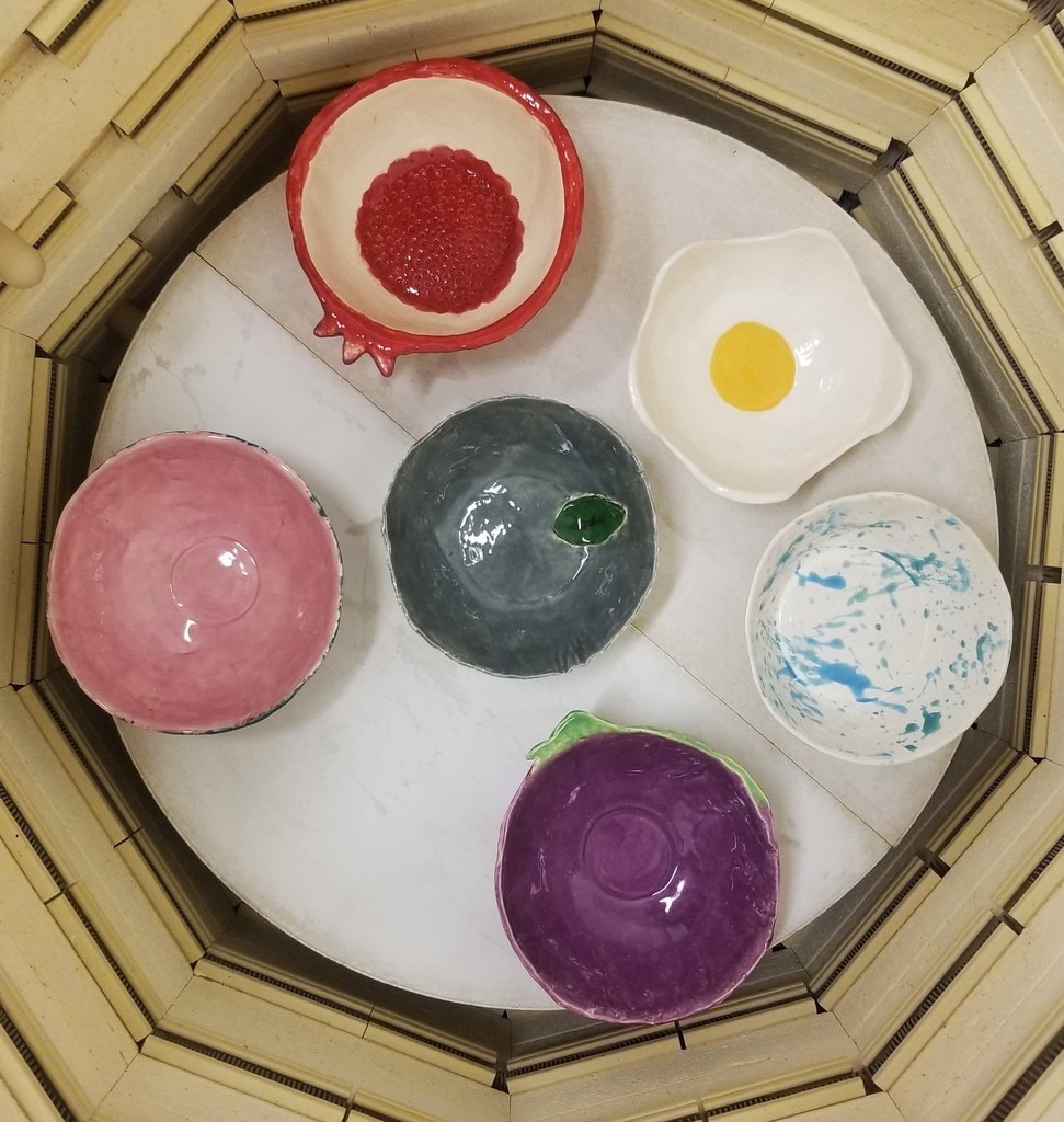 Colorful ceramic bowls prepared by Elgin students.