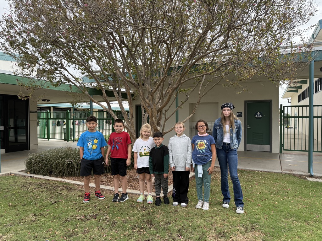 Elk of the Month students in front of tree