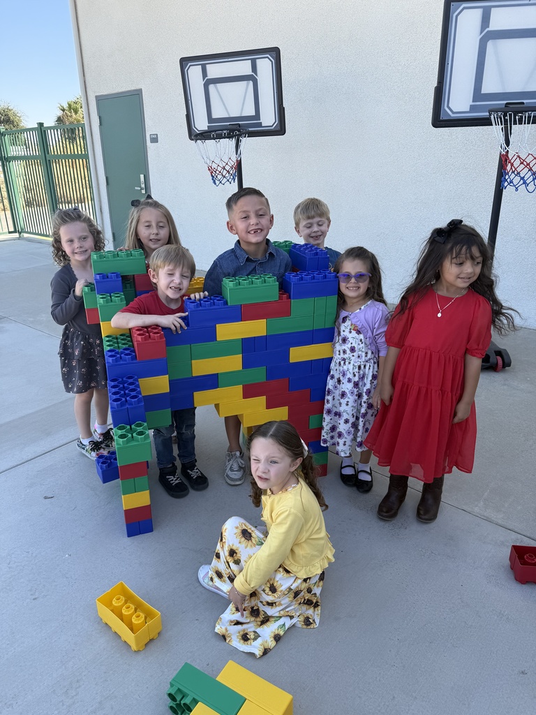 TK/K Student play with large Lego blocks at recess