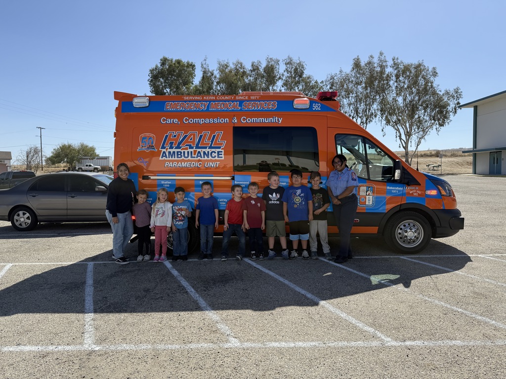 first grade in front of ambluance