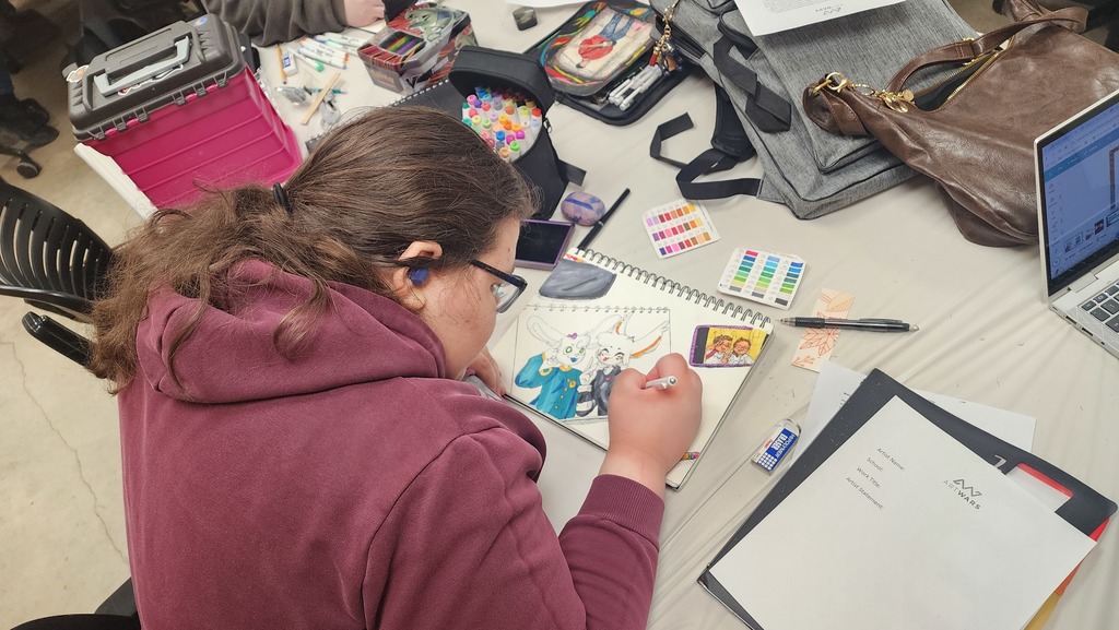 Emma working on her drawing