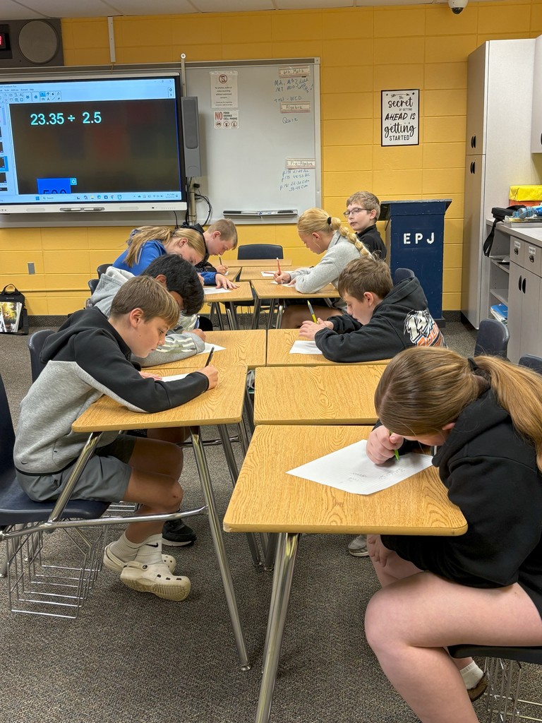 Team work on solving  review problems.