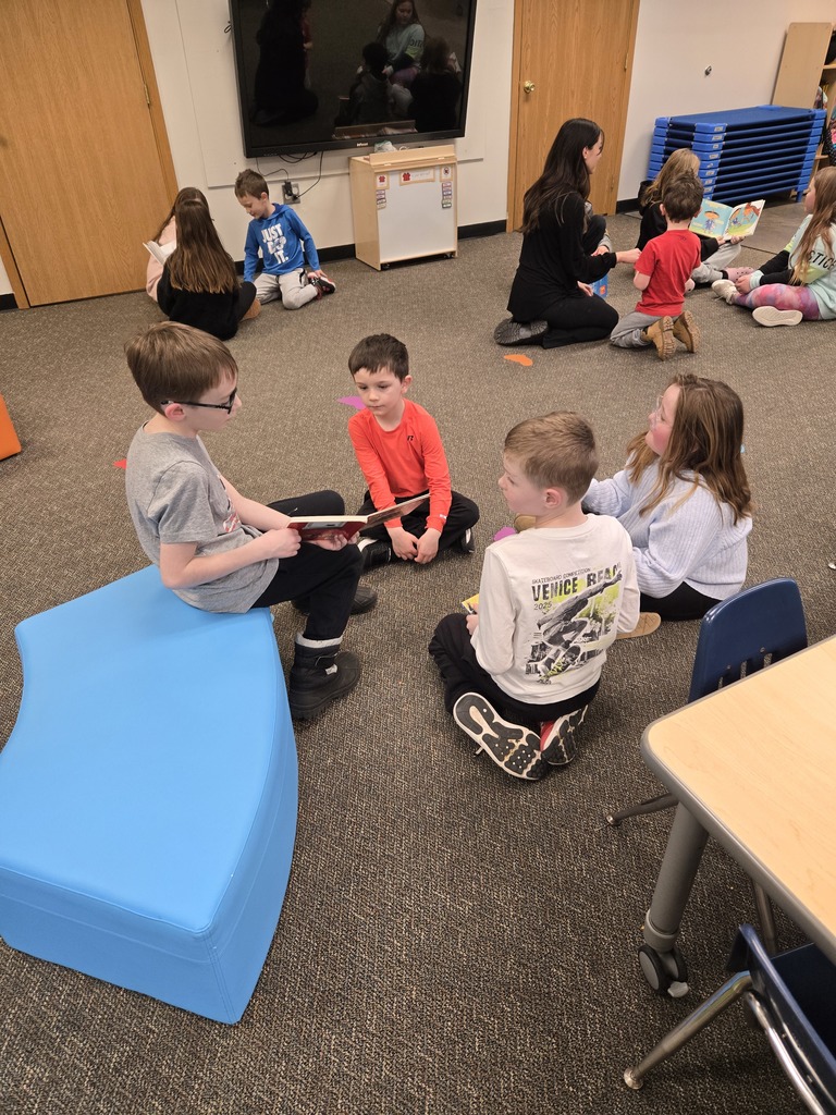 3rd graders read to their preschool buddy