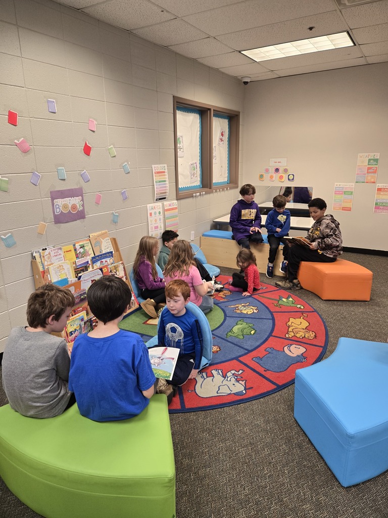 3rd graders read to their preschool buddy
