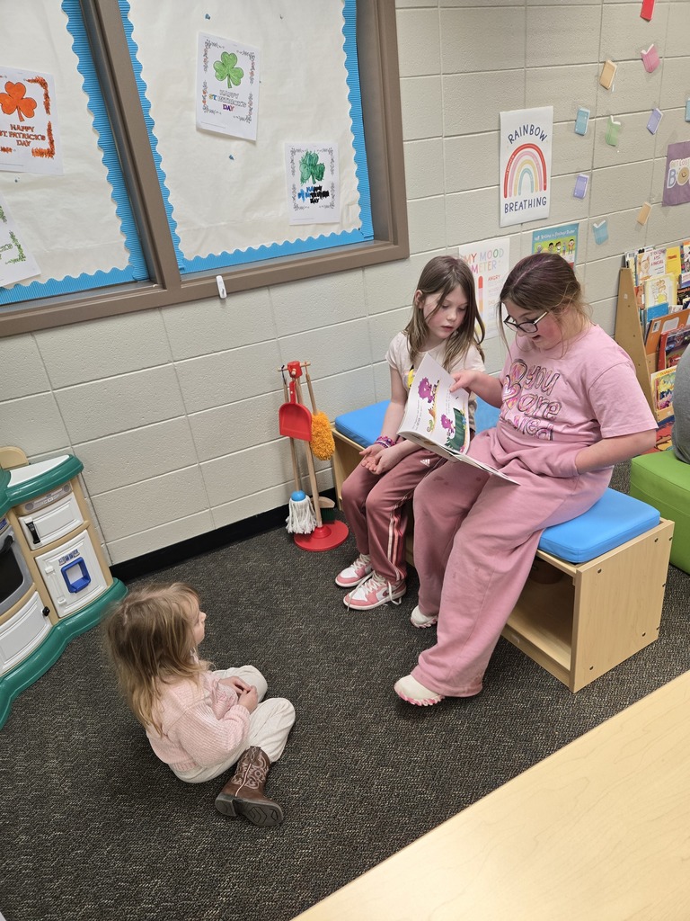 3rd graders read to their preschool buddy