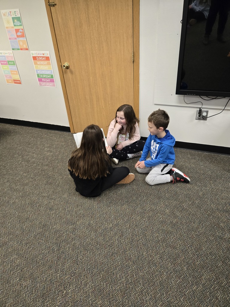 3rd graders read to their preschool buddy