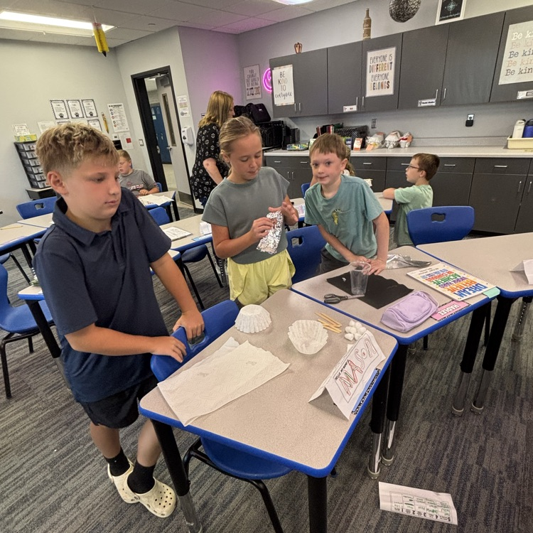 Students create their insulated containers.