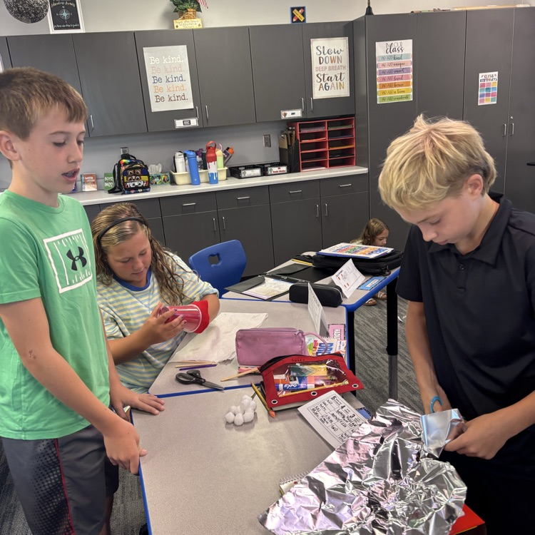       Students create their insulated containers.