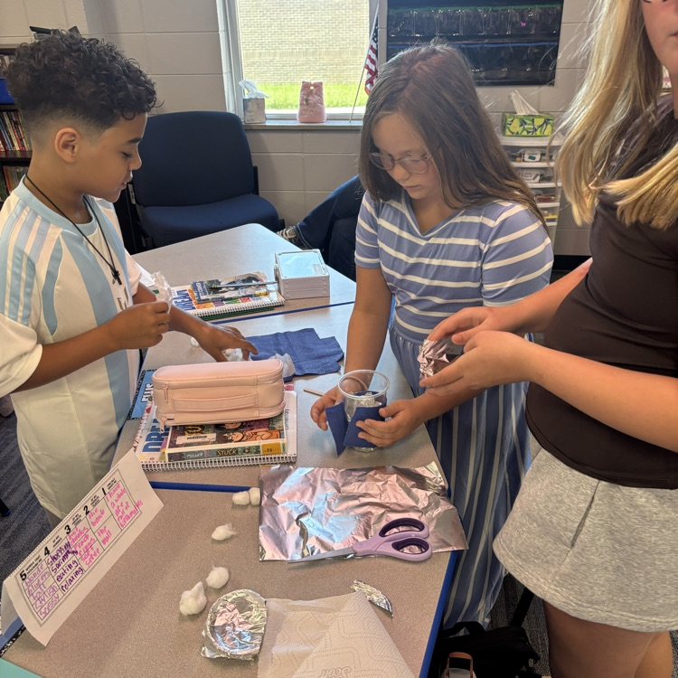 Students create their insulated containers.