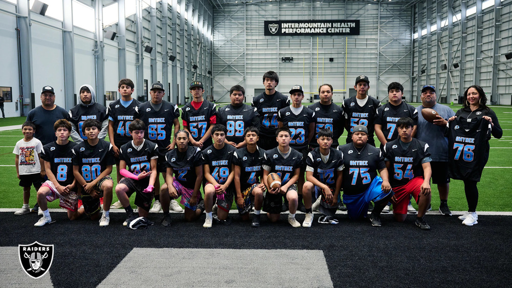 Owyhee High School Football Team with new Jerseys provided by Raiders