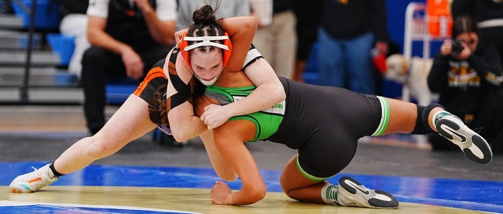 Wells' Tegan Remington takes down Fallon's Cassandra Hooper during the northern girls regional wrestling tournament