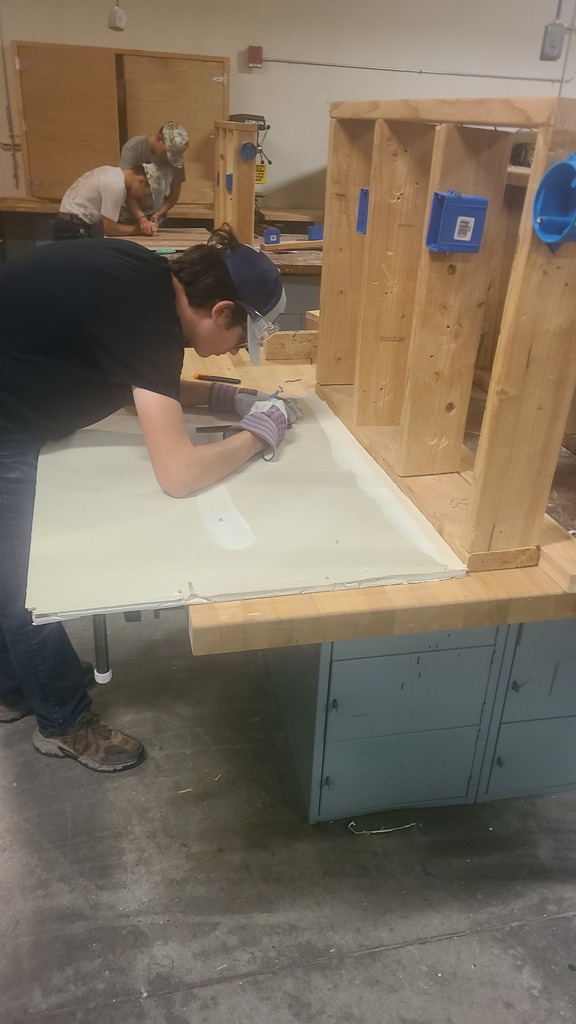 Building trades class members working on sheetrock