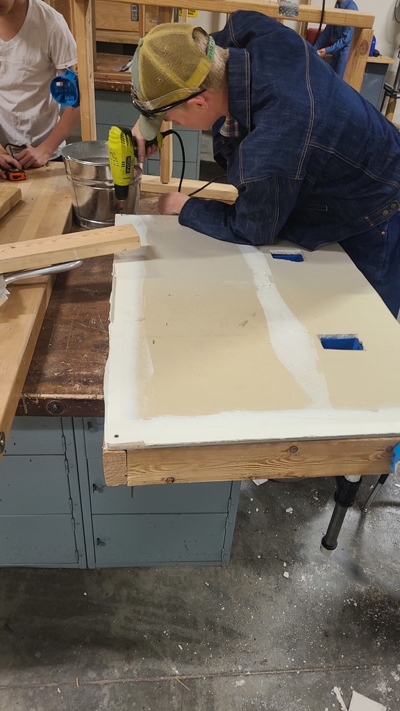 Building trades class members working on sheetrock