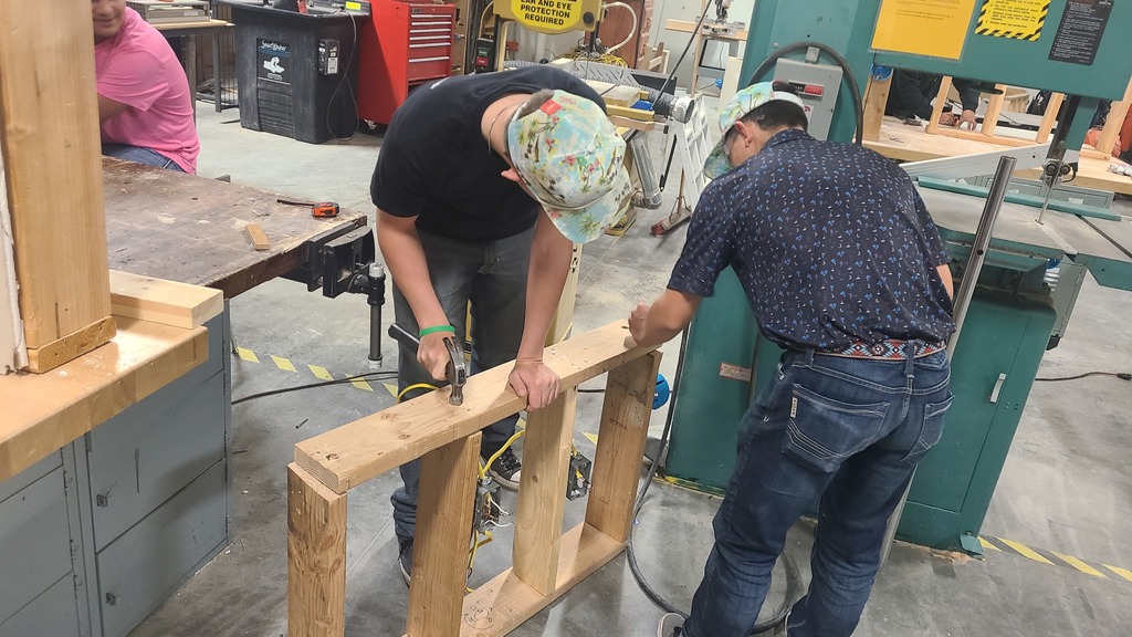 Building trades class members working on sheetrock