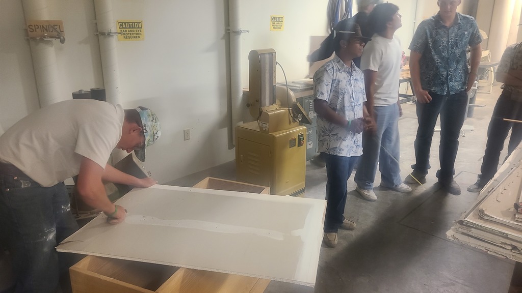 Building trades class members working on sheetrock