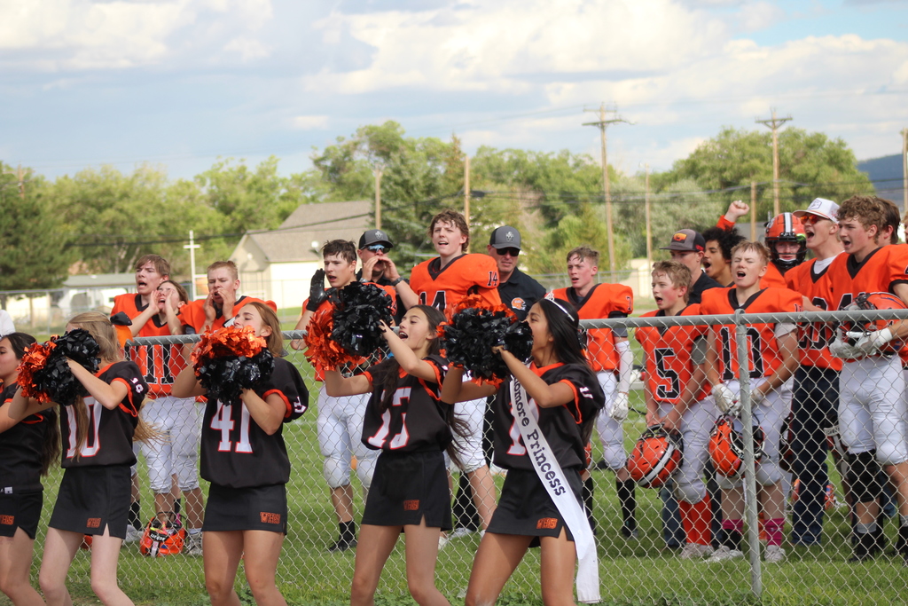 Wells High School football team and cheerleaders