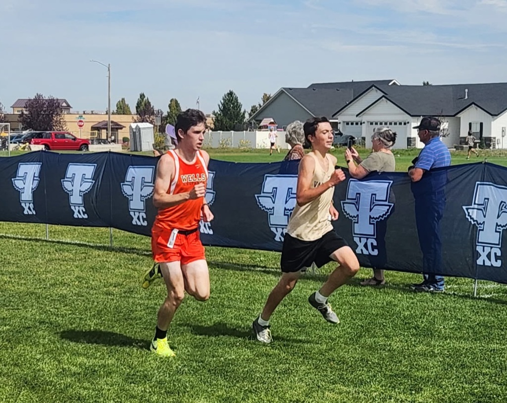 Wells High School cross country team members running in Jerome